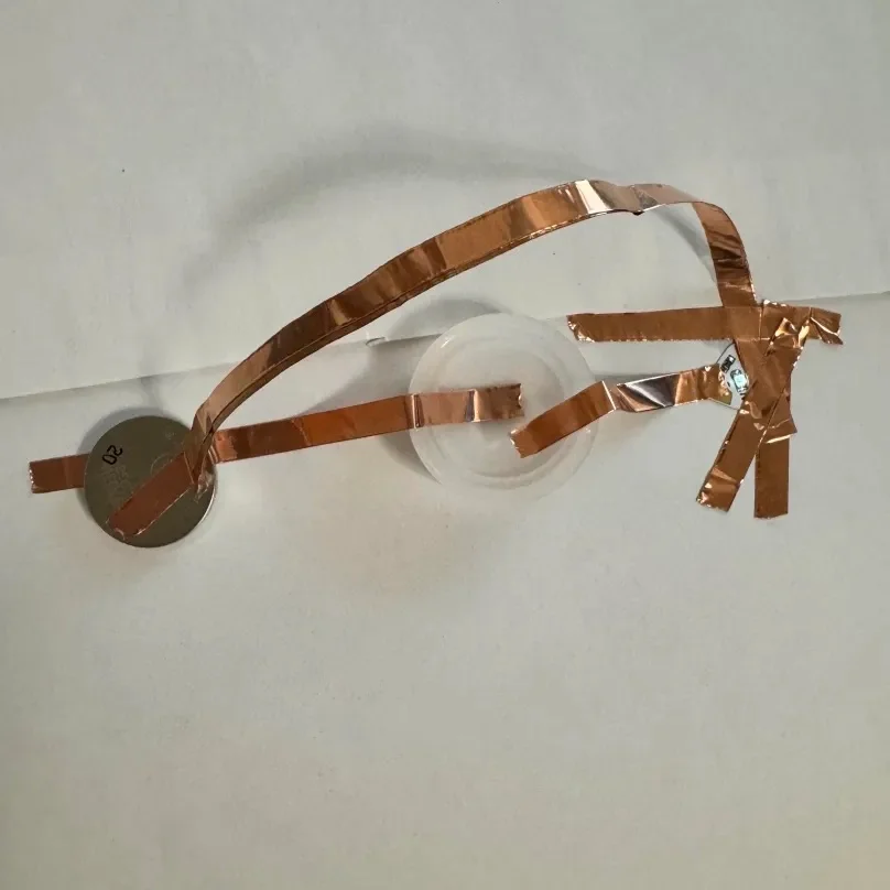 Even though I already knew water can conduct electricity, I wanted to experiment with electrolyte drinks and decided to set water as a sort of baseline. This LED is charged by one battery.