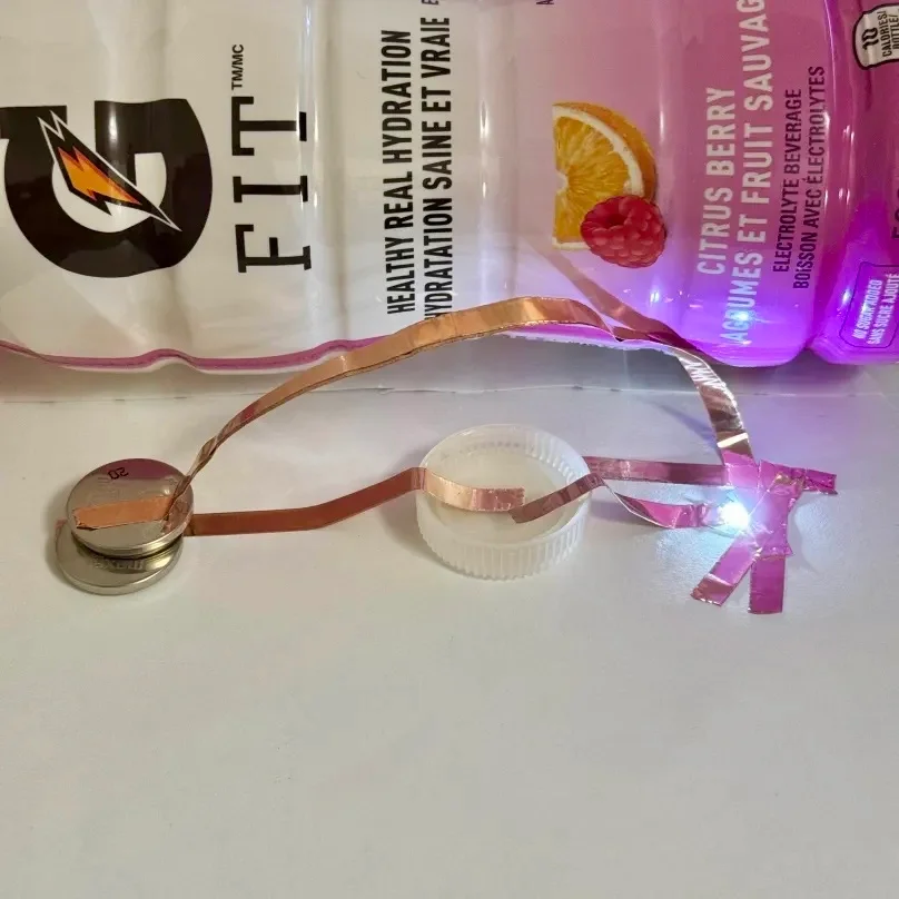 Here's the two-battery Gatorade circuit! Much brighter than the equivalent water circuit! I wasn't expecting to see this much of a difference, but it makes sense since the Gatorade would conduct electricty more effectively with the electrolytes.