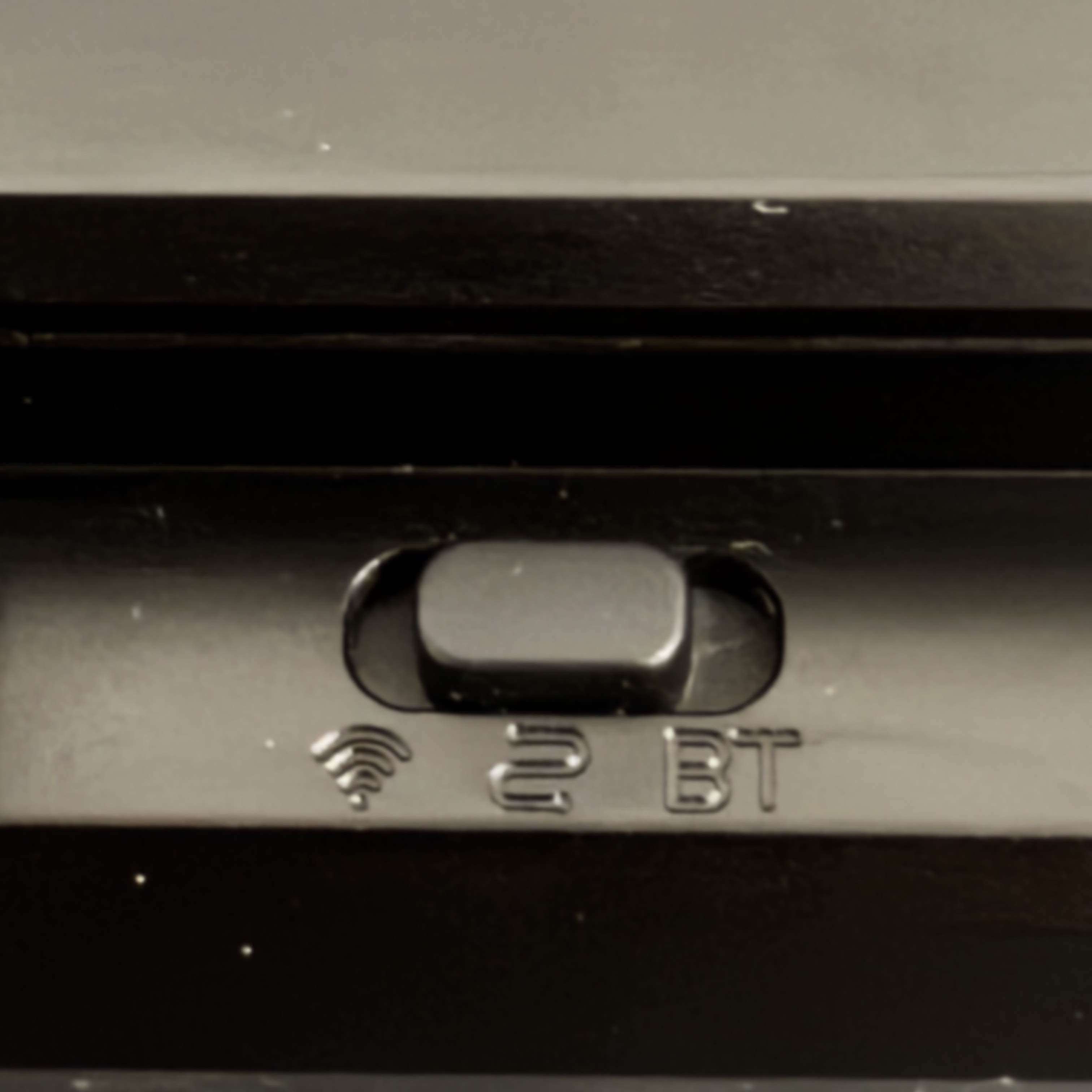 The keyboard can be connected to a device using three different methods, 2.4gHz, traditional USB cord, or Bluetooth. The desired connection type has to be set with this switch. They use a Wi-Fi symbol to represent 2.4gHz connection, a squiggly line for corded connection, and BT to represent Bluetooth (which I feel like should've been the Bluetooth symbol instead).