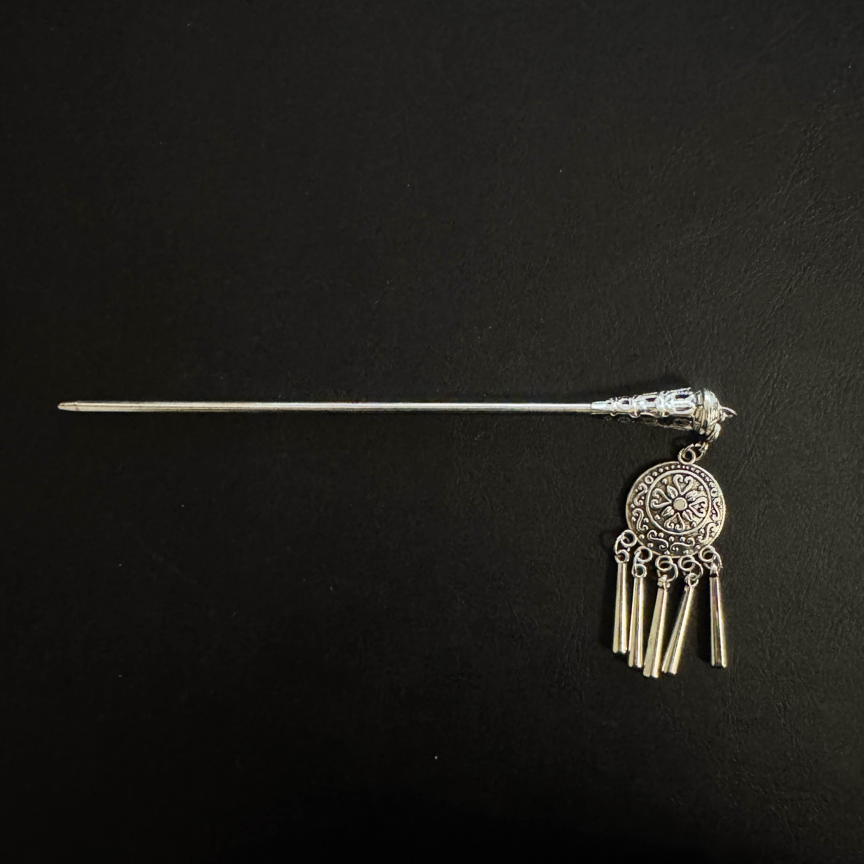 At home or at school, sometimes I'll put my hair up with this Qazaq hairpin. It jingles when I walk or shake my head.