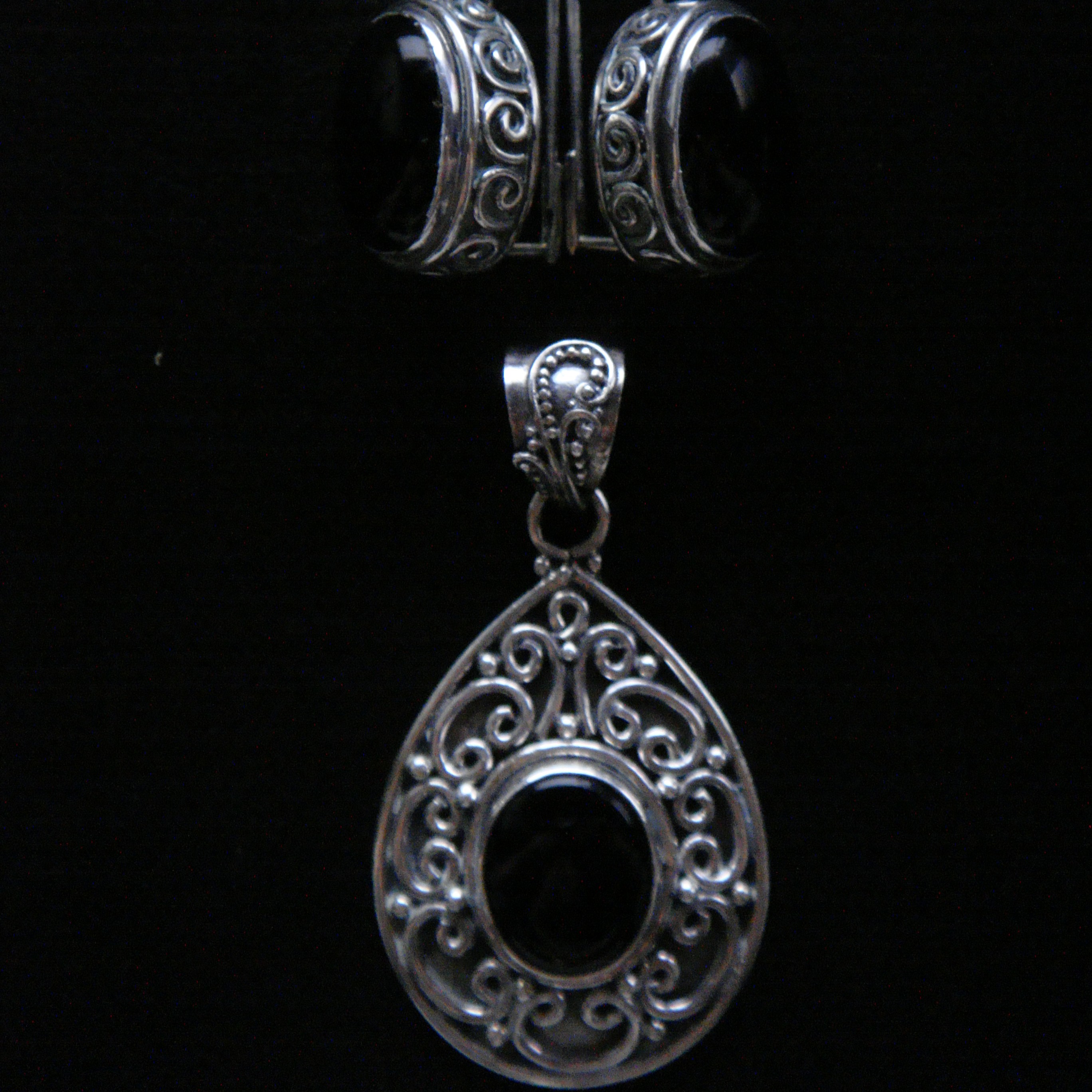 A traditional set of Qazaq earrings and a matching pendant. They were passed down to me by my mom.