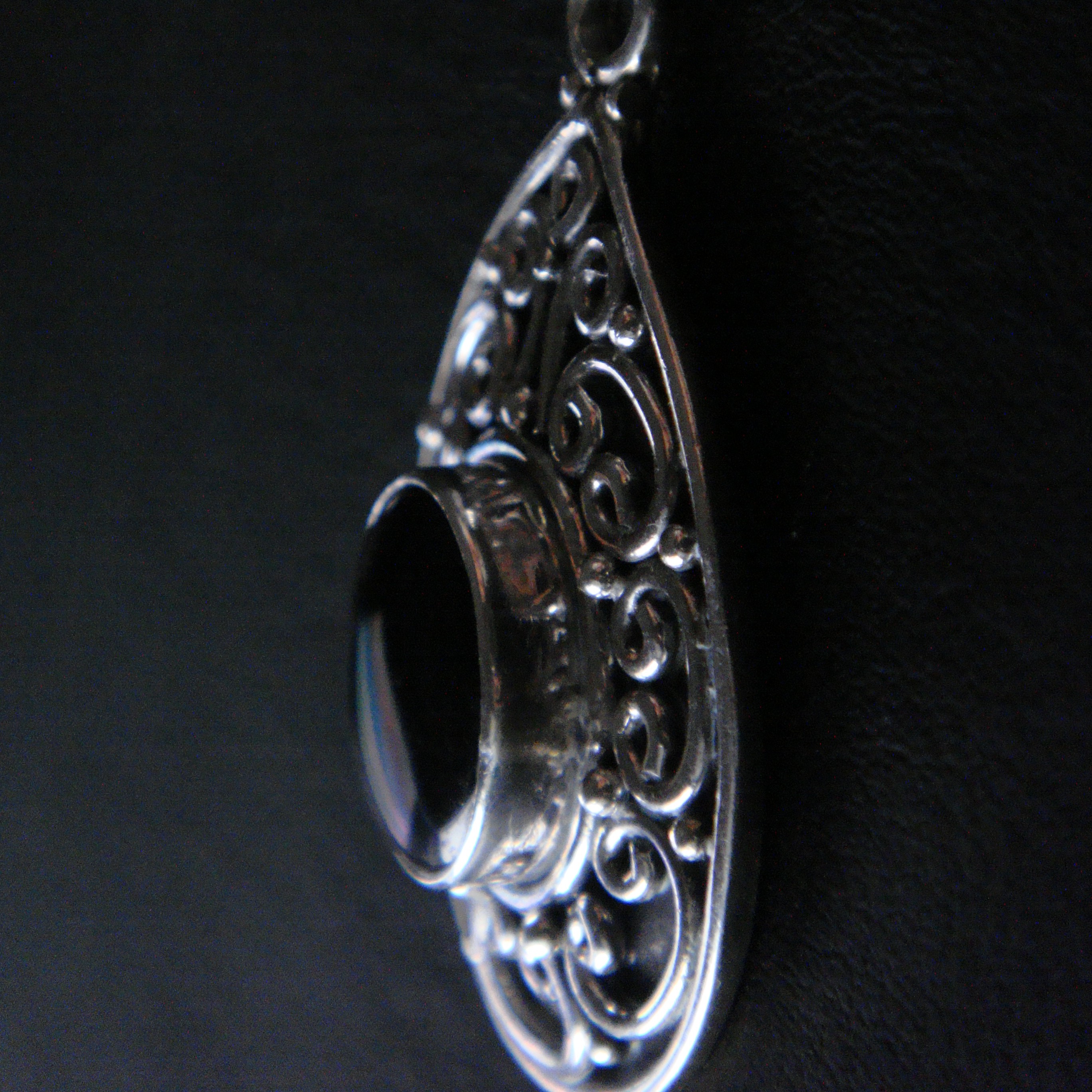 A close-up side shot of the pendant my mom gave me.