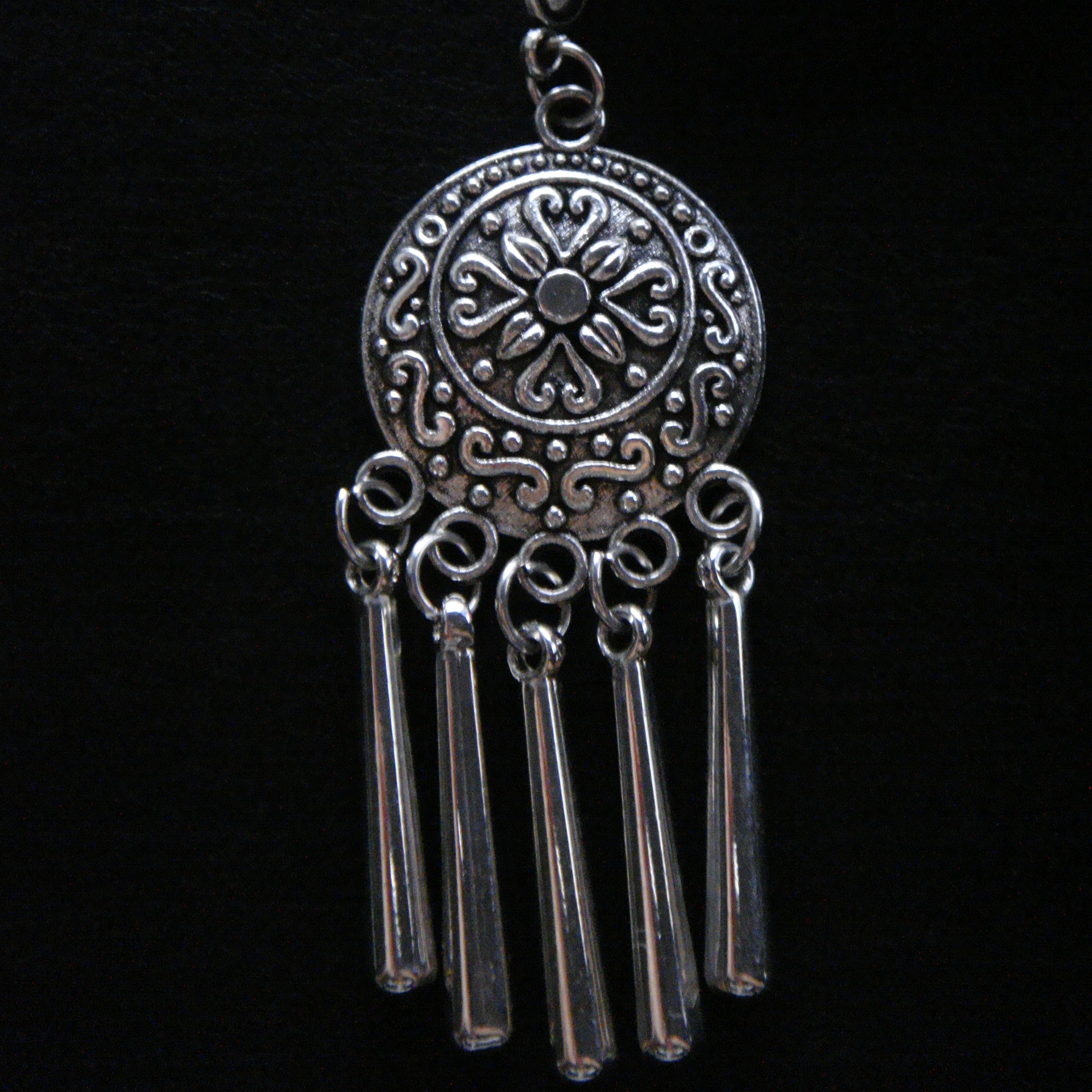 A traditional Qazaq shashtenge—literally translated as a hair coin—attached to a hair pin, which isn't Qazaq.