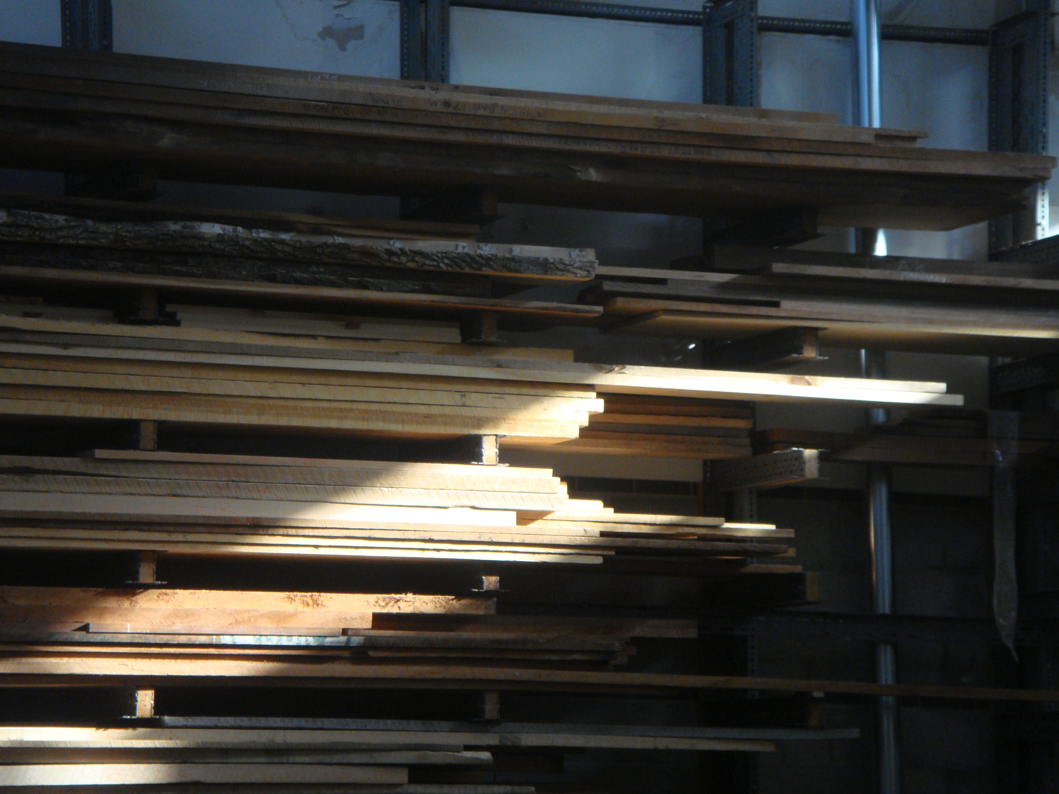 Wood stacked up in the furniture studio in Sheridan's AA Wing. Students using this studio are typically in Craft and Design, specializing in Furniture.